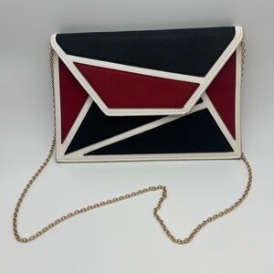 Color block faux leather red white and black purse 8 x tall 12 in tall. Not wide
